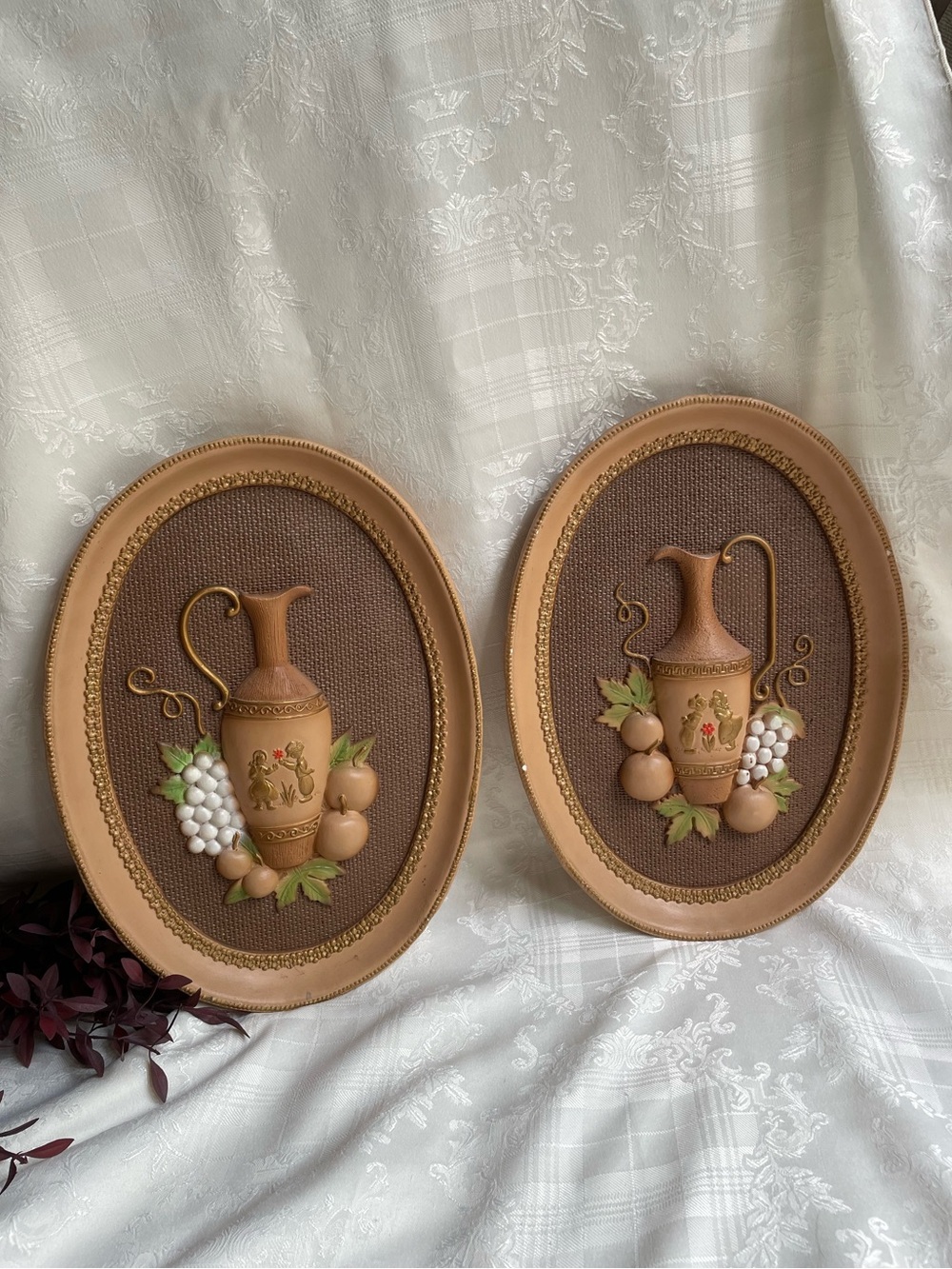 Girotti Chalkware pair of wall hangings featuring jug and fruit
